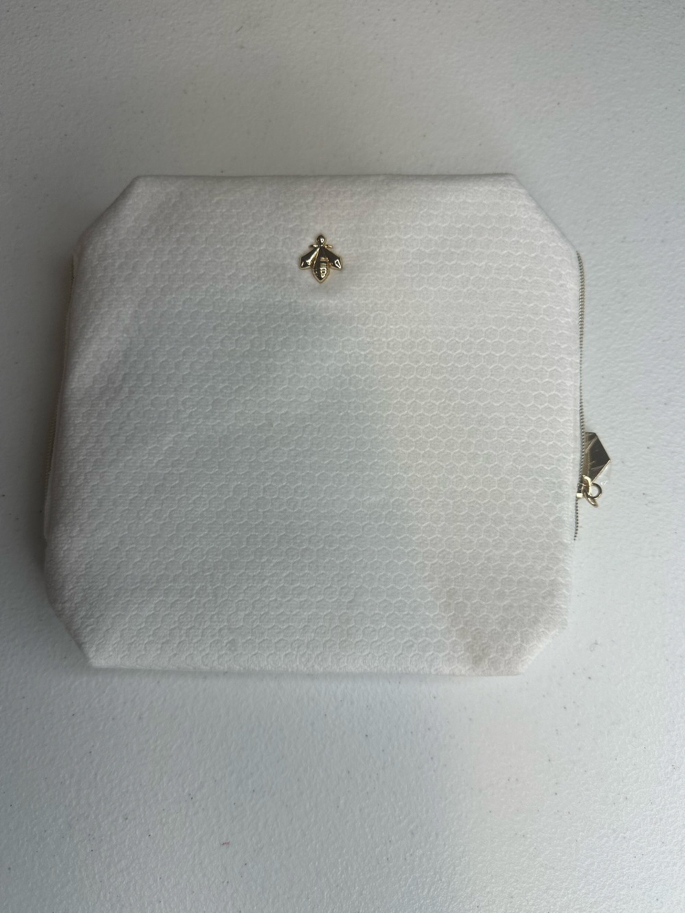 GUERLAIN beauty White Textured Pouch with Gold Hexagon Charm